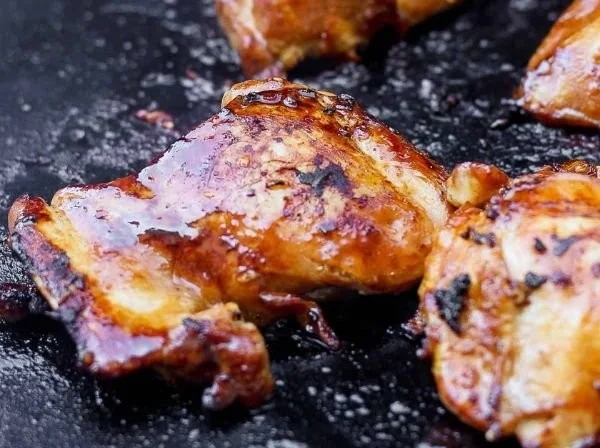 Grilled Blackstone chicken thighs served with roasted vegetables
