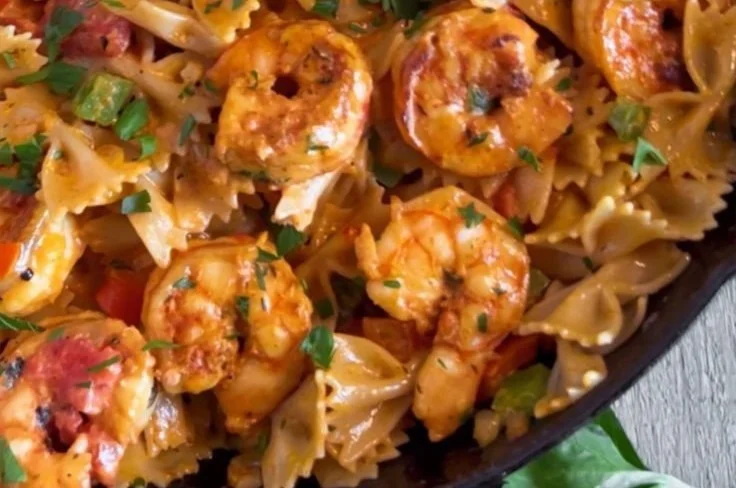 Plate of Cajun Shrimp Pasta garnished with parsley and spices