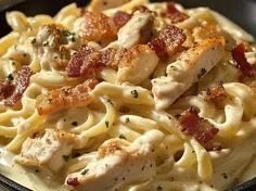 Creamy Chicken Bacon Ranch Pasta with ranch Alfredo sauce in a bowl.