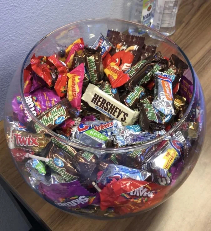 Delicious chocolate bowl filled with assorted sweets and treats