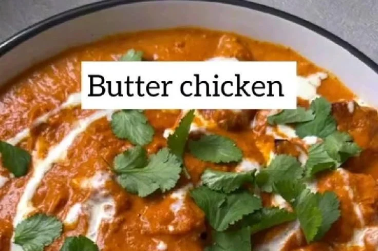 Creamy butter chicken dish garnished with herbs