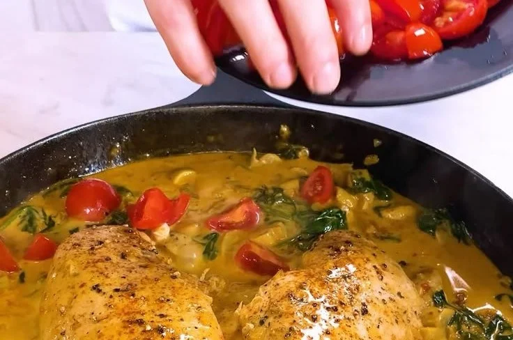 Delicious plate of creamy chicken garnished with herbs