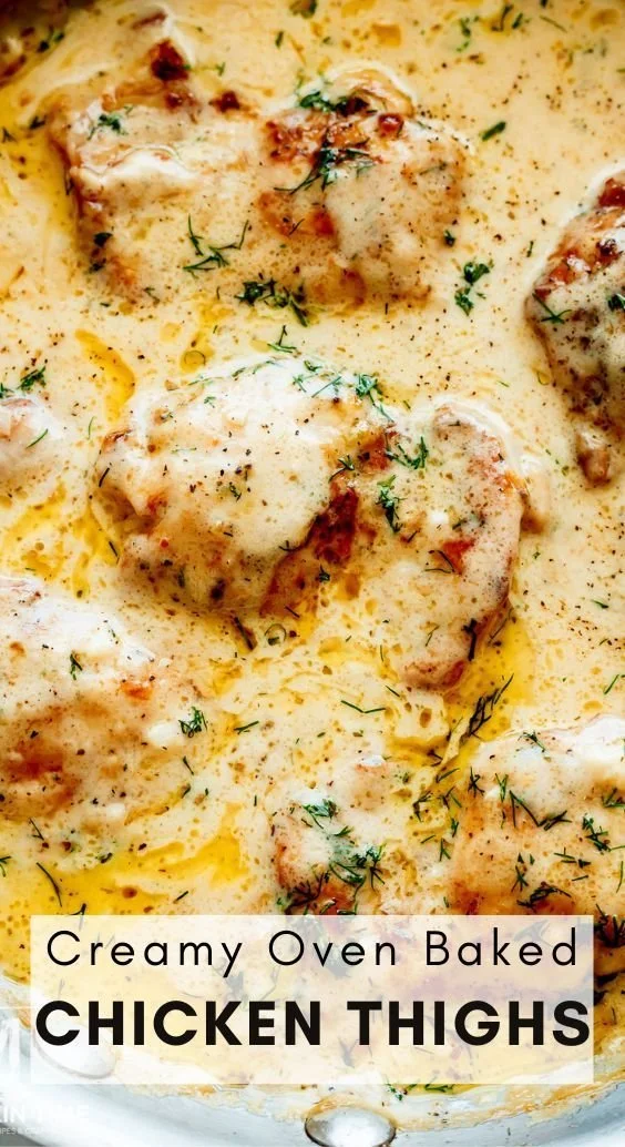 Creamy oven baked chicken thighs dish served with herbs and spices