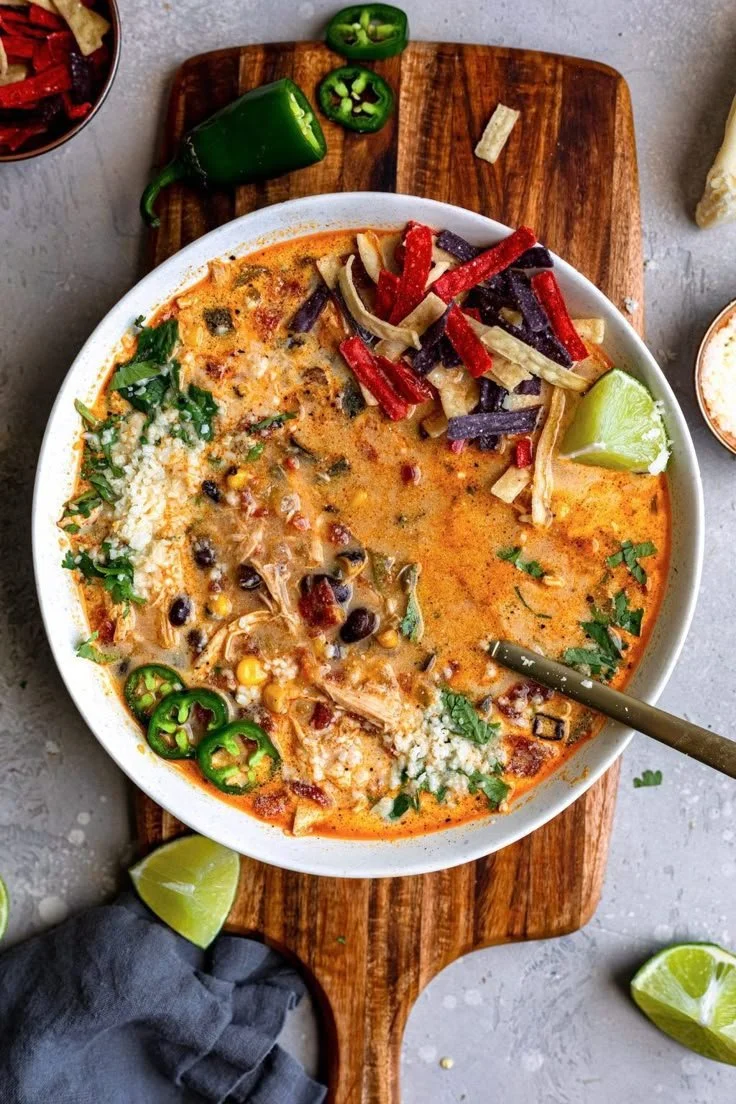 A bowl of creamy chicken tortilla soup made in a Crock-Pot.