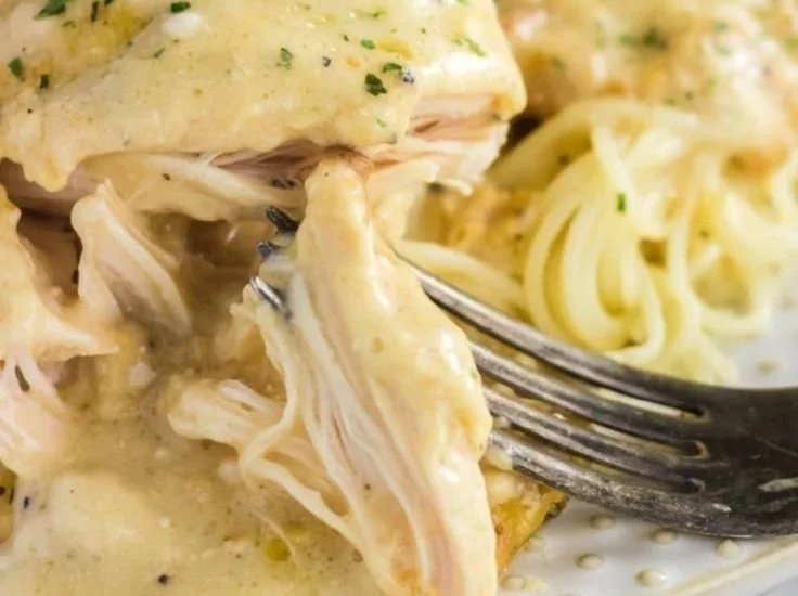 Crockpot Angel Chicken served with a side of vegetables and herbs