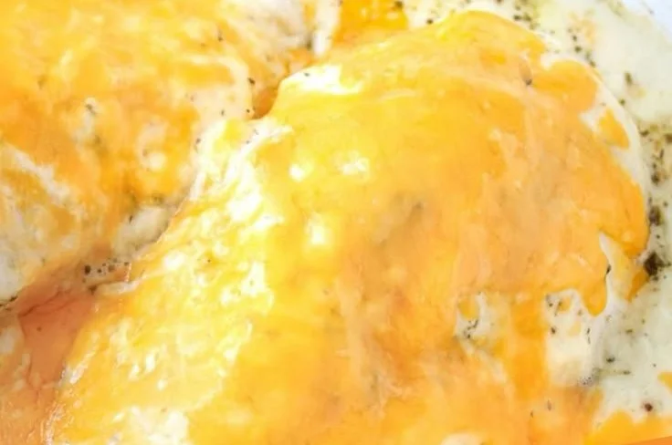 Creamy garlic chicken dish with herbs and spices, served in a bowl