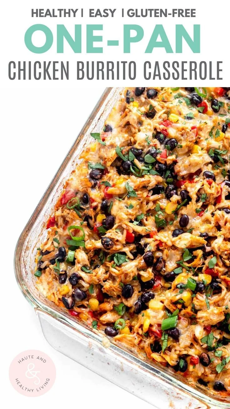 Easy chicken burrito casserole served in a baking dish with toppings